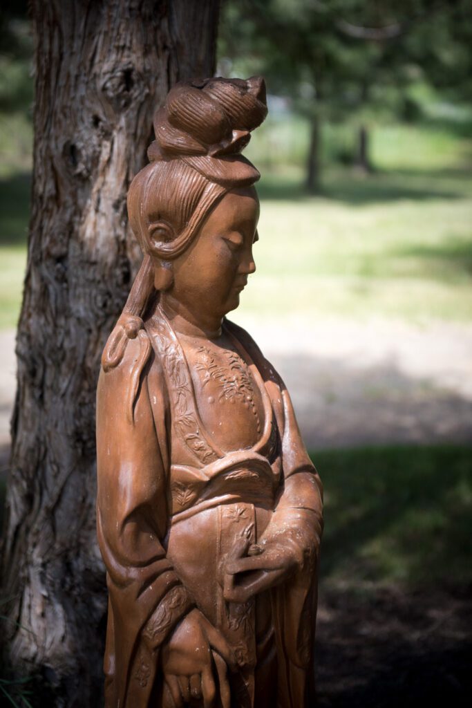 Kuan Yin Under Juniper Wallowa Buddhist Temple photo by Alyson Levy